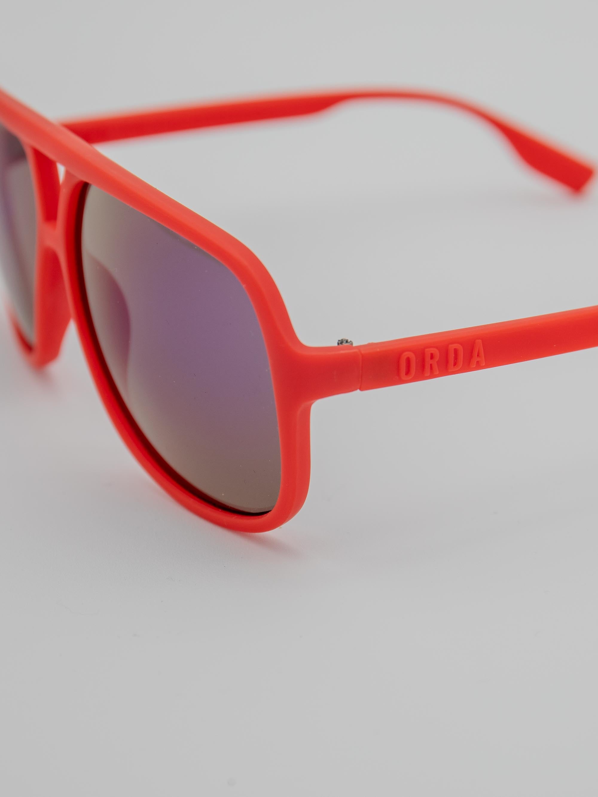 ORDA Leftside – Red Velo Grip Frame with Mirrored Purple Chromo Vue™ Lens Sunglasses